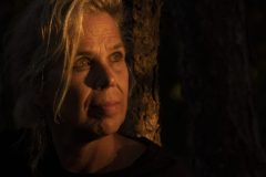 “Fine art portrait of strong woman in a minimal setting, focusing on stillness, light, and presence.”