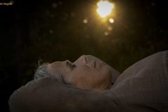 “Fine art portrait of strong artistic strong woman in a minimal setting, focusing on stillness, light, and presence.”